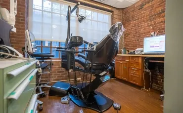 Treatment room with a window and exposed brick