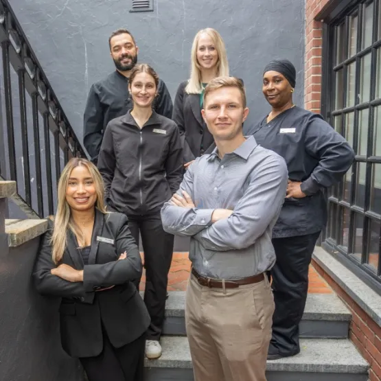The Turning Leaf Dental team on the office stairs